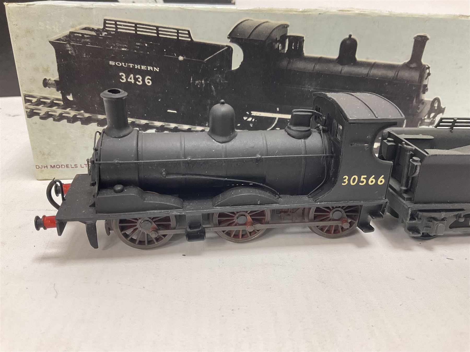 ‘00’ gauge - two kit built steam locomotive and tenders comprising Class 0395 Jumbos 0-6-0 no.30566 finished in BR black; Class C2X Large Vulcans 0-6-0 no.32434 finished in BR black; both with DJH Models boxes (2) 