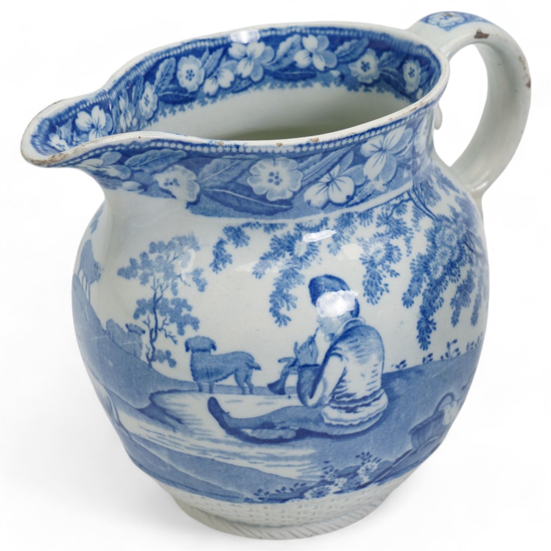 Three 19th century blue and white transfer printed jugs, two of helmet form, the other with basket weave moulded base, together with a 19th century blue and white meat plate, L52.5cm (4)