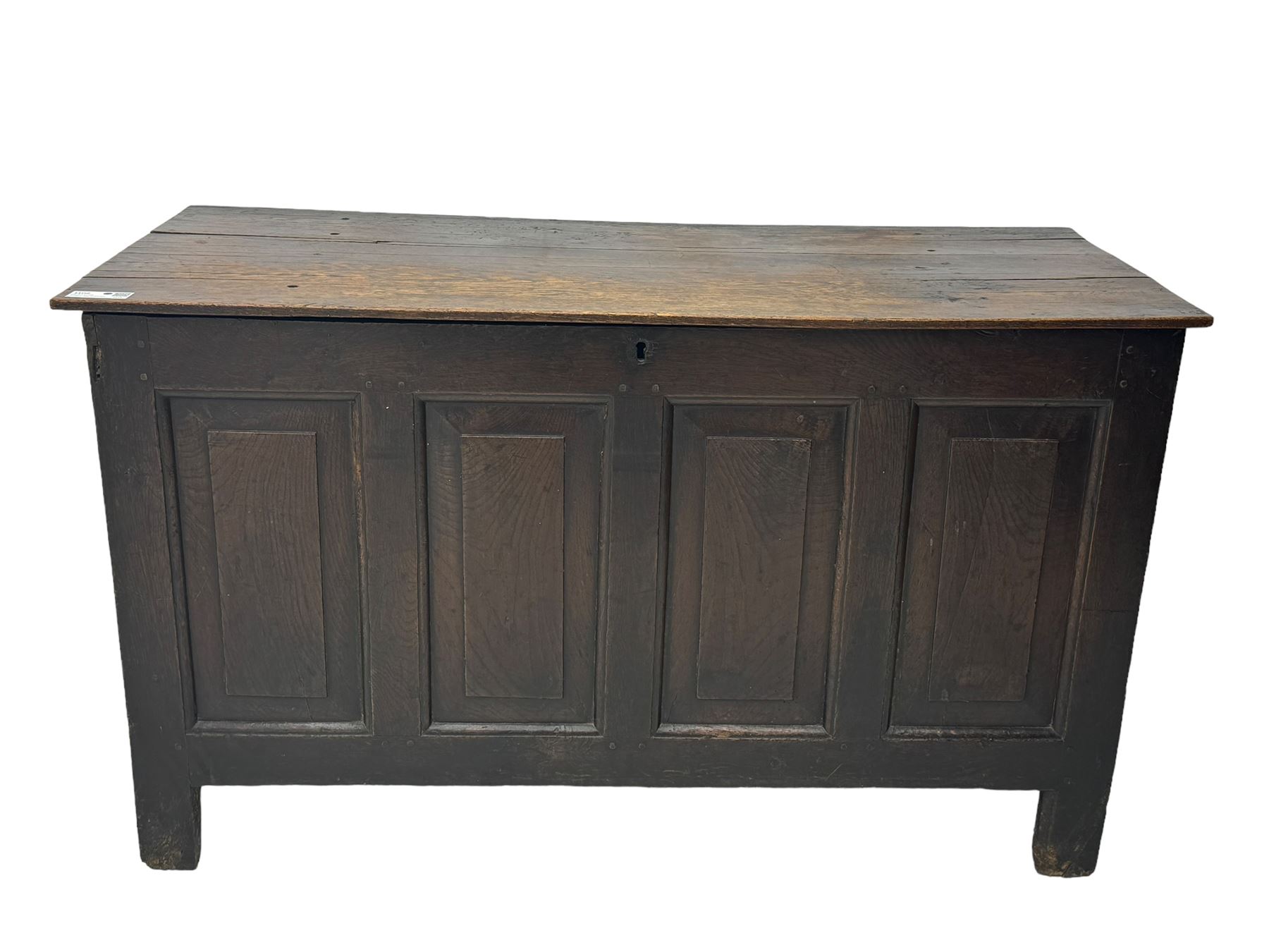 18th century oak coffer, rectangular plank lid over four panelled front and panelled sides, on stile supports 