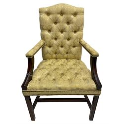 Georgian design mahogany framed Gainsborough open armchair, upholstered in pale gold buttoned fabric with floral pattern, on square moulded supports united by plain stretchers 