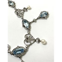 Early 20th century platinum milgrain set aquamarine, diamond and pearl trace link chain fringe necklace, circa 1910, five oval aquamarines, three with diamond and pear shaped aquamarine drops separated by four diamond heart shaped details, each with a suspended pearl