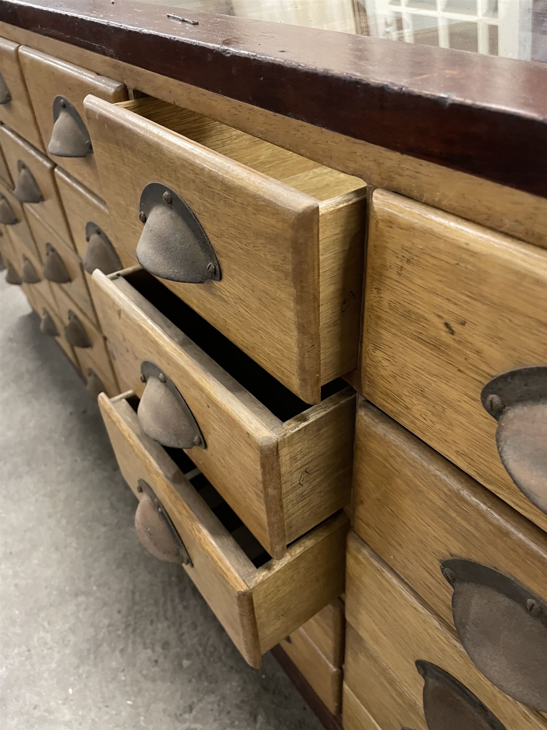 20th century mahogany and glazed haberdashery shop's display cabinet, fitted with thirty-five small drawers, on skirted base  - THIS LOT IS TO BE COLLECTED BY APPOINTMENT FROM THE OLD BUFFER DEPOT, MELBOURNE PLACE, SOWERBY, THIRSK, YO7 1QY