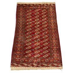 Persian Bokhara rug, red ground and decorated with repeating Gul motifs