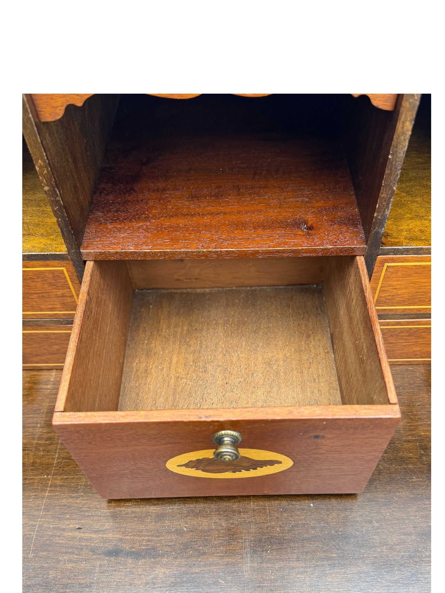 Mid-to-late 20th century inlaid mahogany bureau, inlaid floral medallion to the top, the fall front opening to reveal fitted interior with pigeonholes, small drawers and central cupboard, green inset writing surface with gilt tooling, four drawers below with brass handles, raised on shaped bracket feet