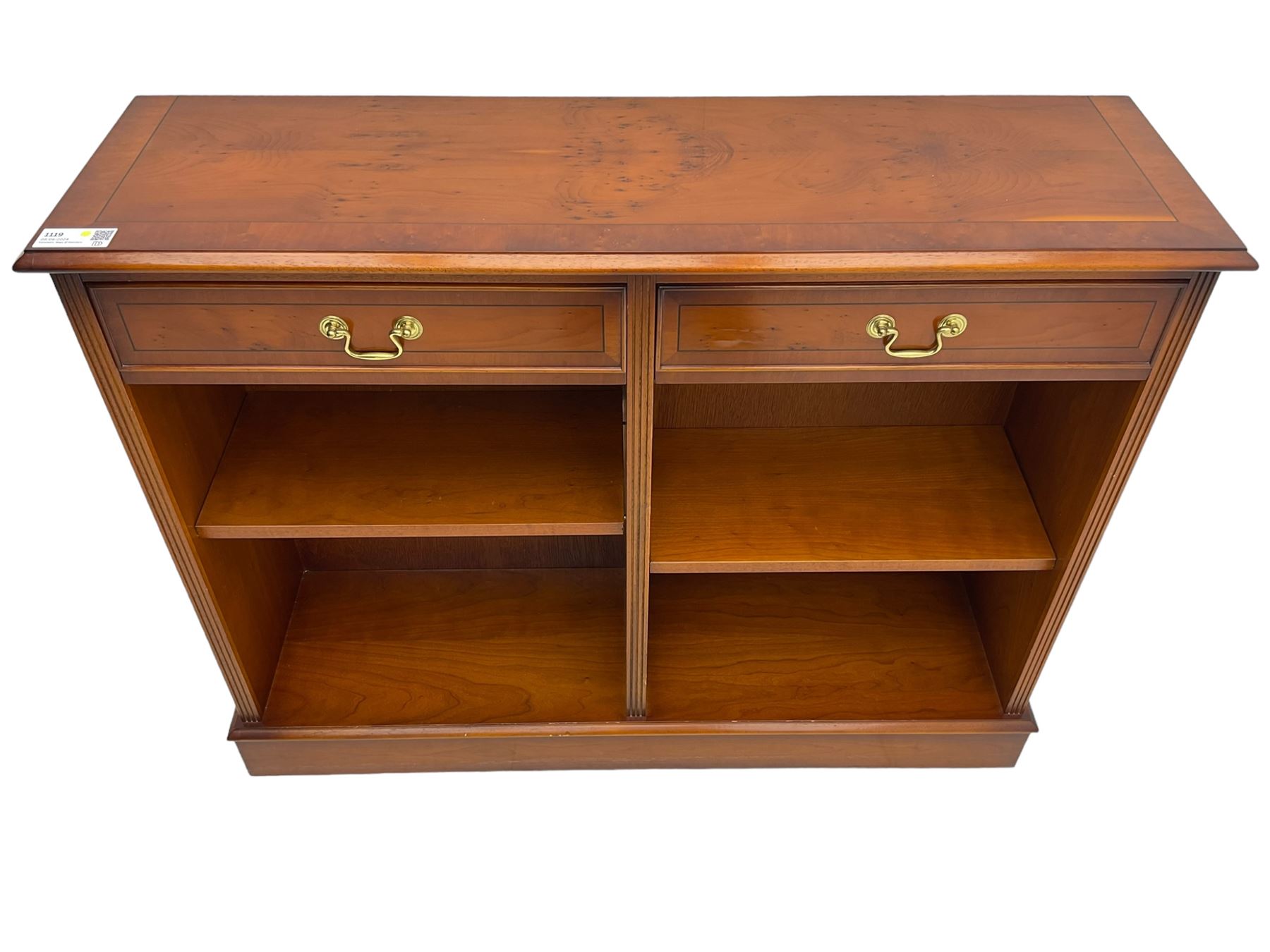 Georgian design yew wood open bookcase, rectangular moulded top over two drawers and two adjustable shelves, on moulded plinth base 