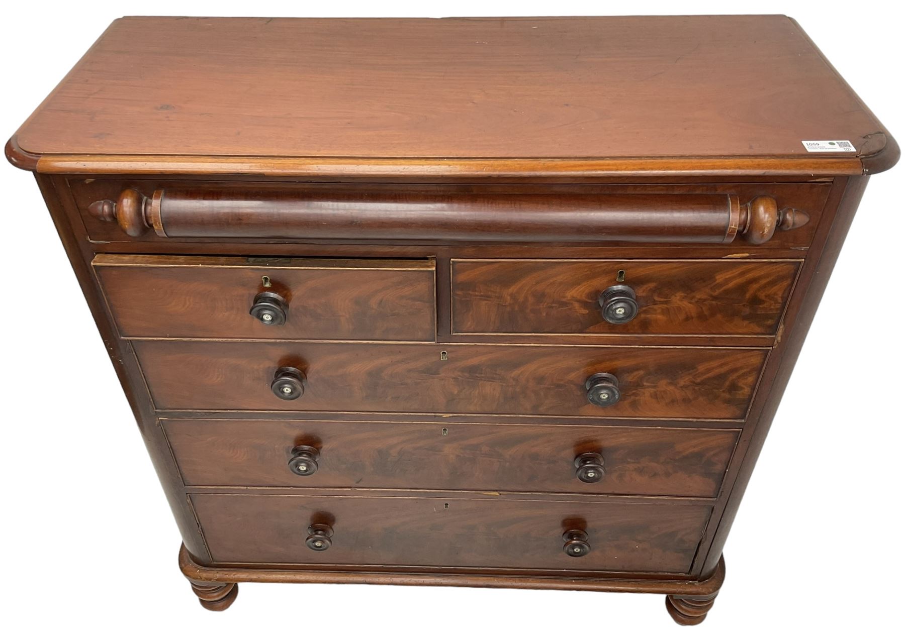 Victorian mahogany chest, rectangular moulded top with rounded corners, the frieze drawer with turned half column mount, two short and three long cock-beaded drawers, on turned feet