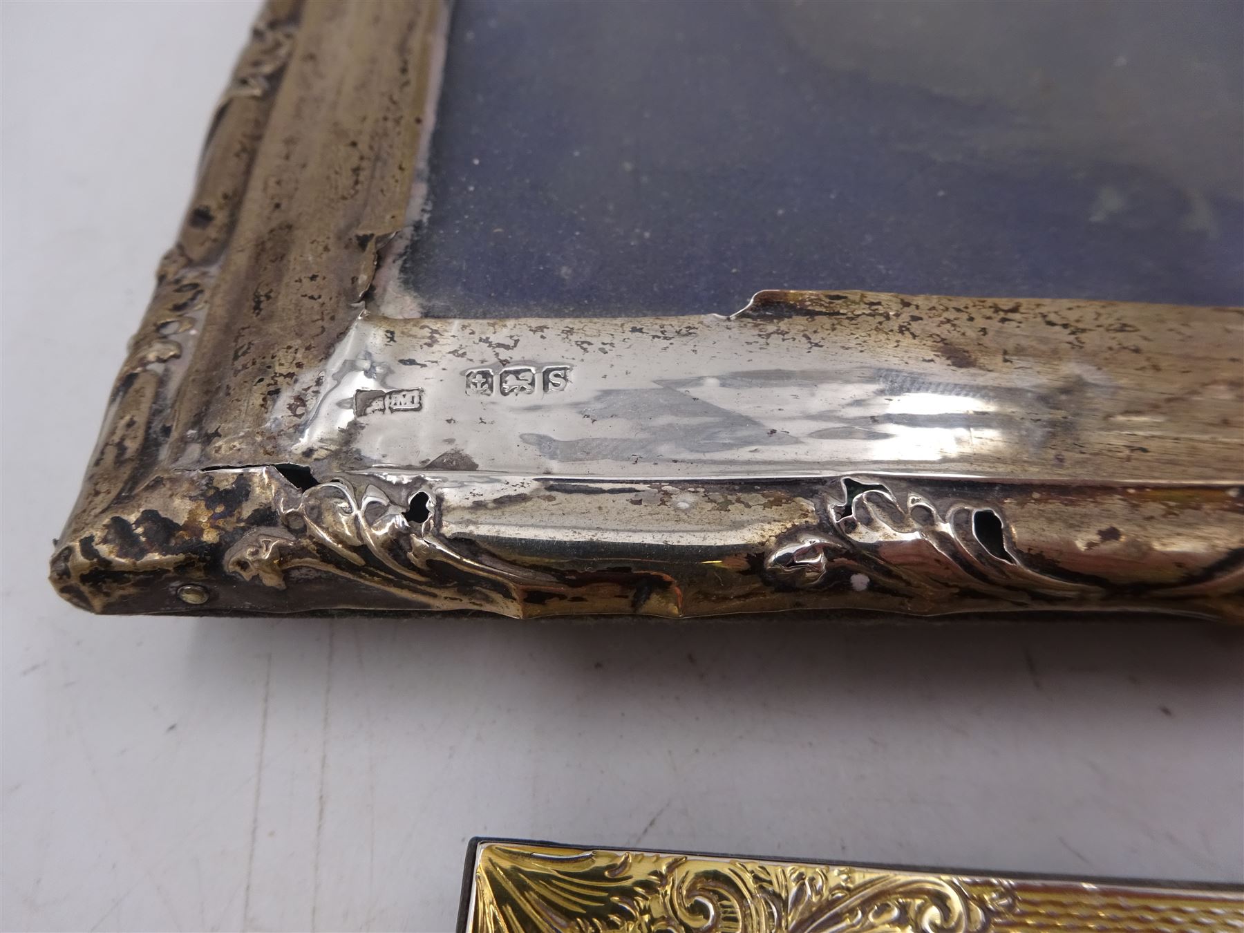 Four silver mounted photograph frames, comprising pair of early 20th century examples, and two smaller modern examples, all hallmarked, tallest H19cm