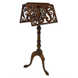 Regency design mahogany duet music stand, double-sided hinged and adjustable reading stands, scrolling leafy branch fretwork with scrolled lyre, fitted with gilt metal reeded columns, on adjustable stem, turned pedestal with tall splayed supports 