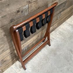 Ten walnut finish folding luggage stands