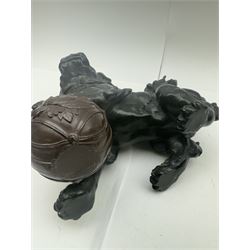 Spelter dog of foo, modelled with one paw placed upon ball, H22cm