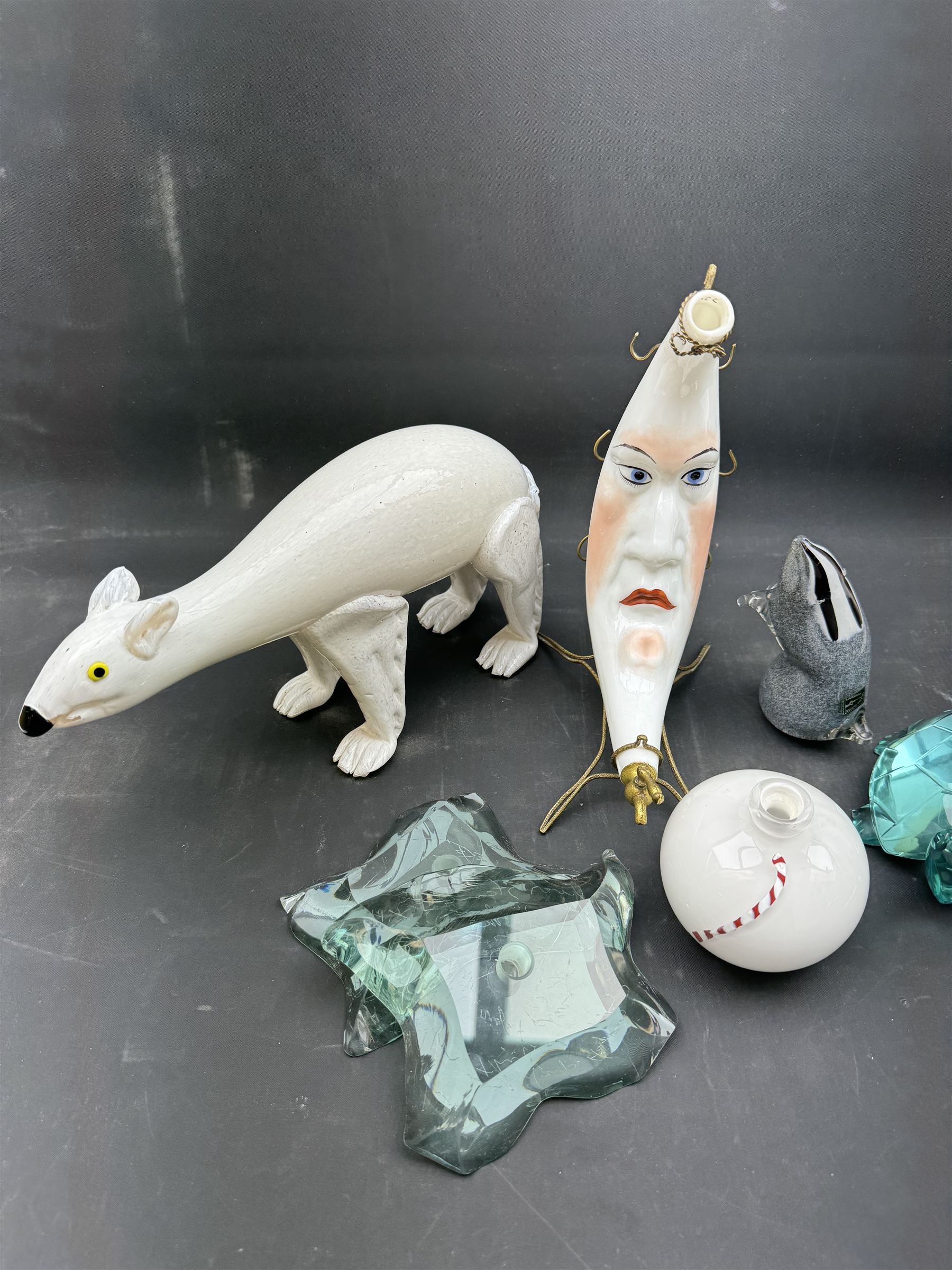 Milk glass decanter, modelled as a moon with a painted face, together with glass animals modelled as a polar bear, turtle and badger, together with other glass  