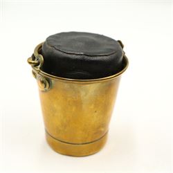 Victorian and later inkwells to include a brass casket form inkwell with hinged cover, a novelty inkwell in the form of a coal bucket with swing handle and leather covered inkwell, various glass examples, together with an early 20th century silver mounted match stick holder/ striker 