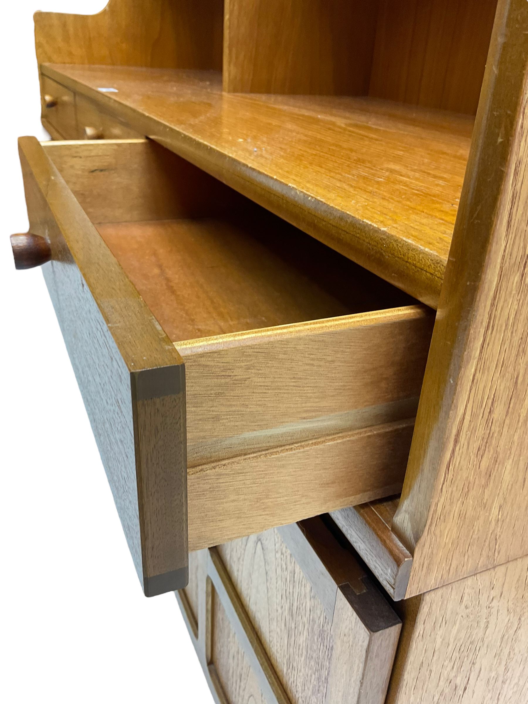 Nathan - teak wall unit, fitted with raised display cabinet and fall front compartment, three drawers and three cupboards below