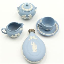 Wedgwood Jasperware miniature tea set for one, on a matched tray, oval scent bottle with silver cover, four caddy spoons, miniature bell, seven thimbles, together with a cased pair of portrait medallions of Josiah Wedgwood FRS and Thomas Bentley 