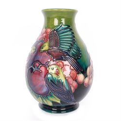 Moorcroft vase of baluster decorated in the Finches pattern with green ground, designed by Sally Tuffin, with makers mark beneath, H20cm