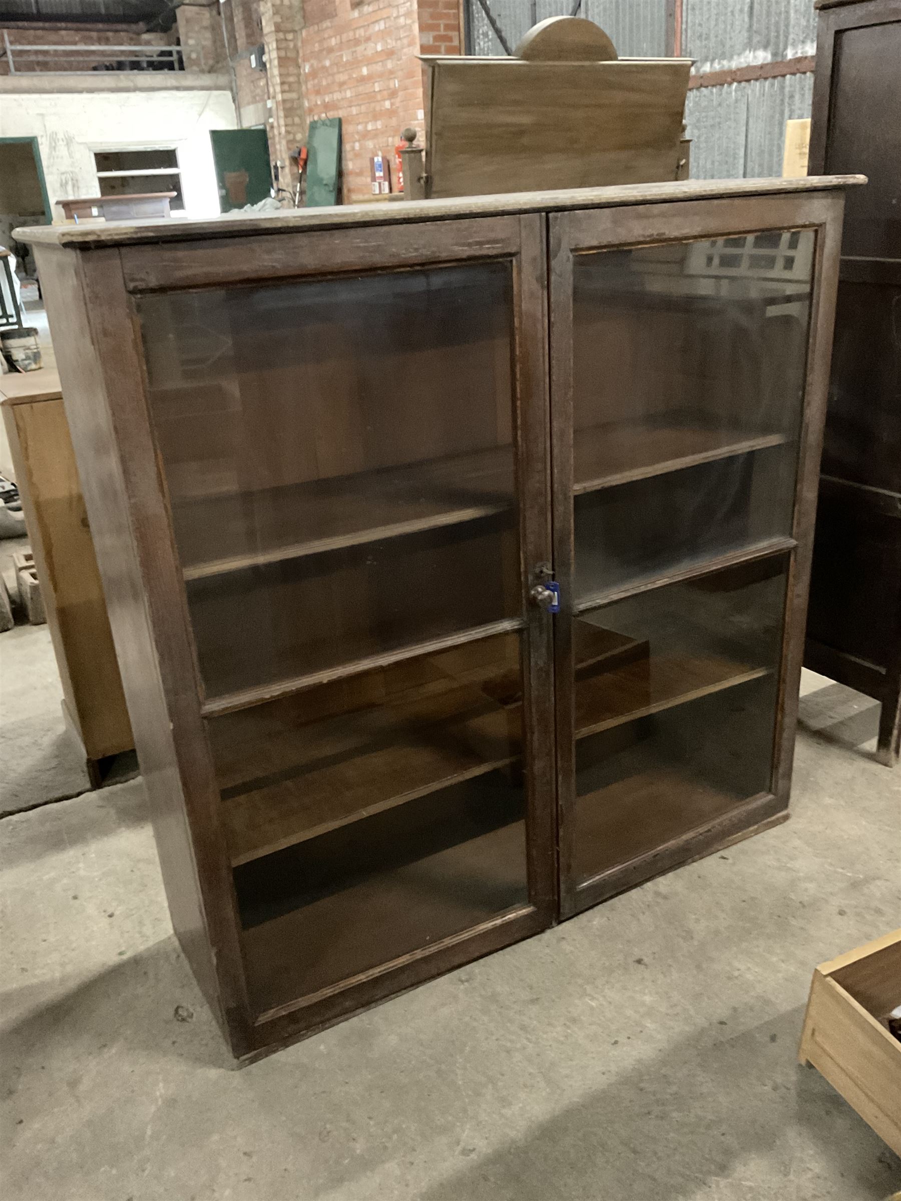 20th century painted pine standing bookcase, fitted with two glazed doors enclosing two adjustable shelves - THIS LOT IS TO BE COLLECTED BY APPOINTMENT FROM THE OLD BUFFER DEPOT, MELBOURNE PLACE, SOWERBY, THIRSK, YO7 1QY