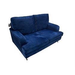 Howard design - two-seat sofa upholstered in blue fabric, traditional shape with rolled arms, on walnut finish turned feet with brushed metal cups and castors