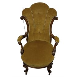 19th century walnut framed open armchair, scallop shaped back with c-scroll uprights, upholstered in yellow buttoned velvet fabric with sprung seat, arm terminals carved with acanthus leaves, raised on scrolling cabriole supports with castors