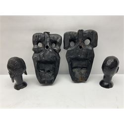 Two African tribal daggers, four carved masks/busts and similar collectables