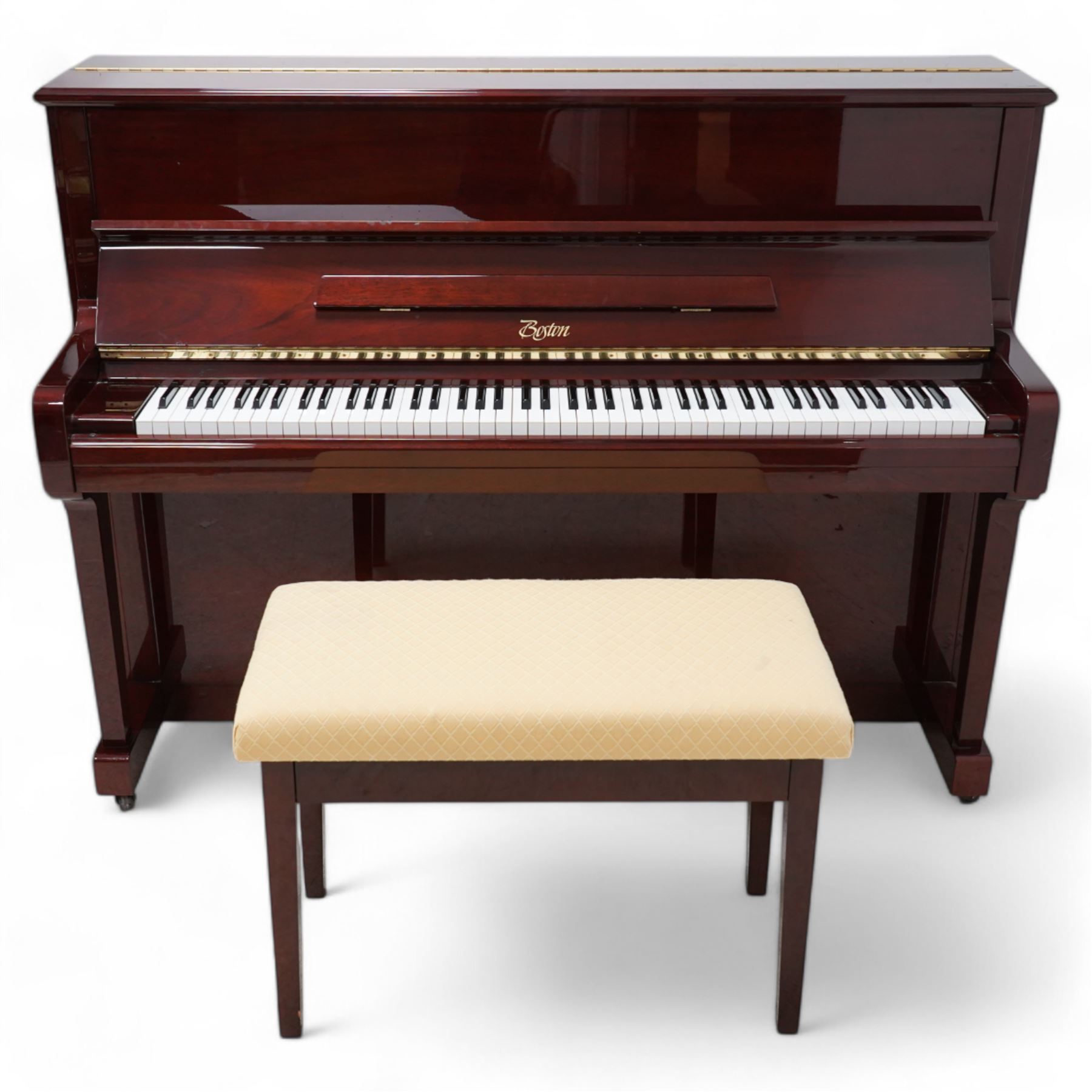 Boston - Upright overstrung piano in a lacquered mahogany case, designed by Steinway and manufactured by Kawai in Japan, Model 118E, serial No 131623 (1999), with 88 synthetic ivory/ ebony keys (seven octaves) with mute, una-corda and sustain pedals, original nickel plated tuning pins, hammers, strings and damper felts. With matching duet stool.