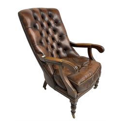 Georgian design mahogany framed library armchair, upholstered in buttoned chocolate brown leather with studwork and loose seat cushion, raised on turned supports with brass castors