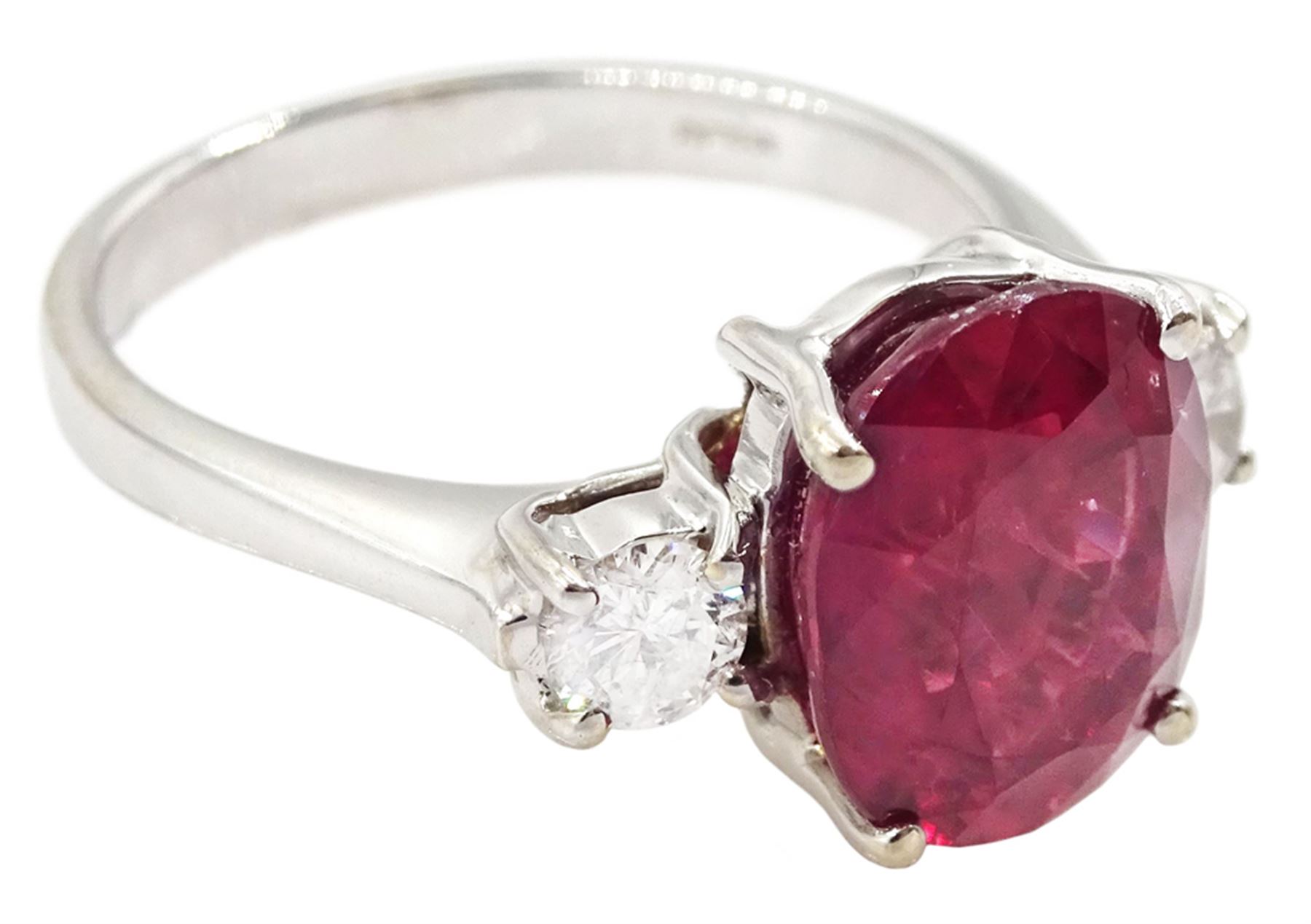 18ct white gold three stone oval cut ruby and round brilliant cut diamond ring, hallmarked, ruby approx 4.30 carat