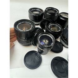 Seventeen Canon camera lenses, mostly FD examples, including 28-85mm 1:4 serial no, 49881, 35-105mm 1:3.5-4.5 serial no. 87632 and 135mm 1:2.8 serial no. 48336, one boxed