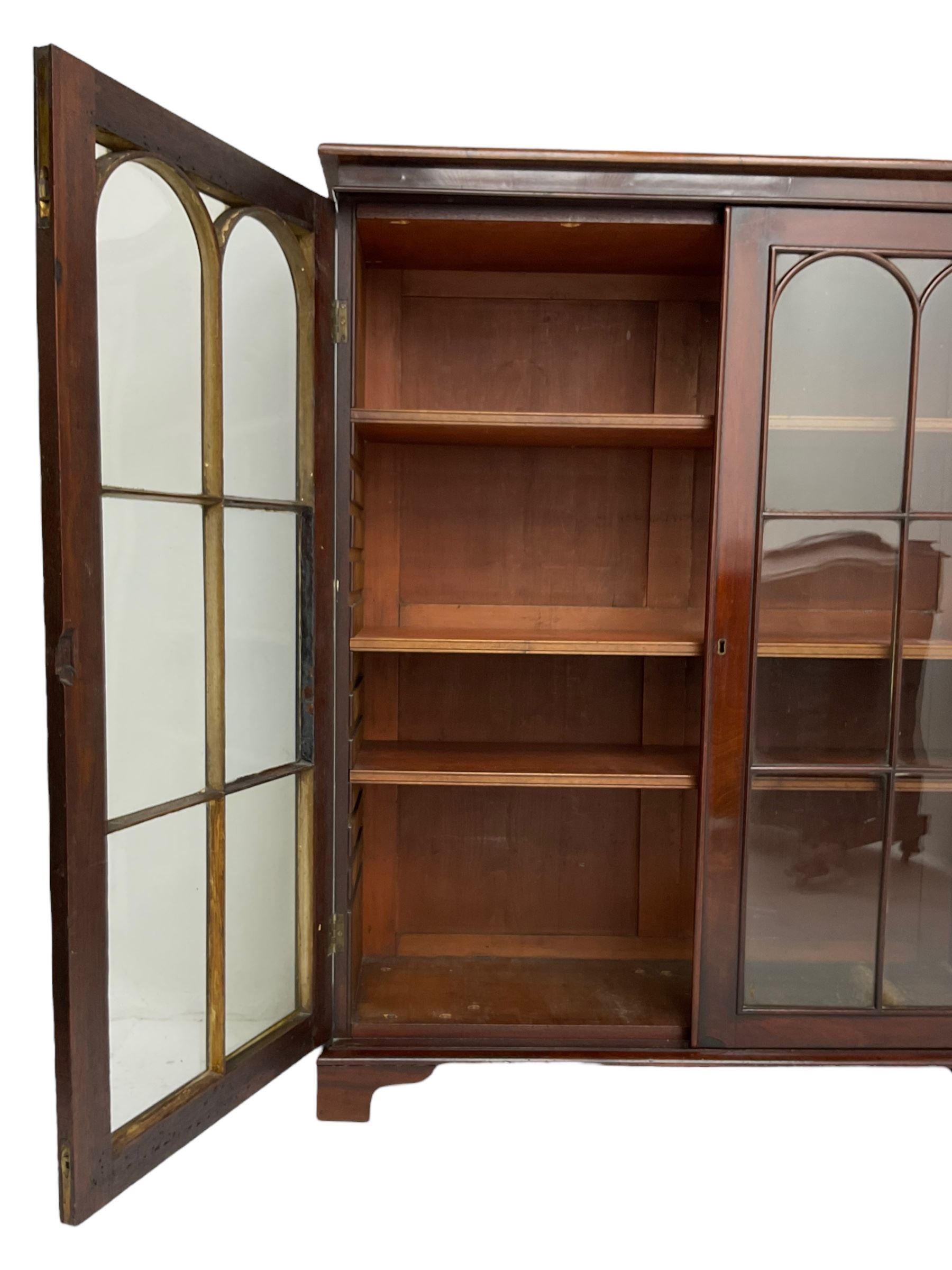 Early 20th century mahogany bookcase, fitted with two astragal glazed doors enclosing three adjustable shelves