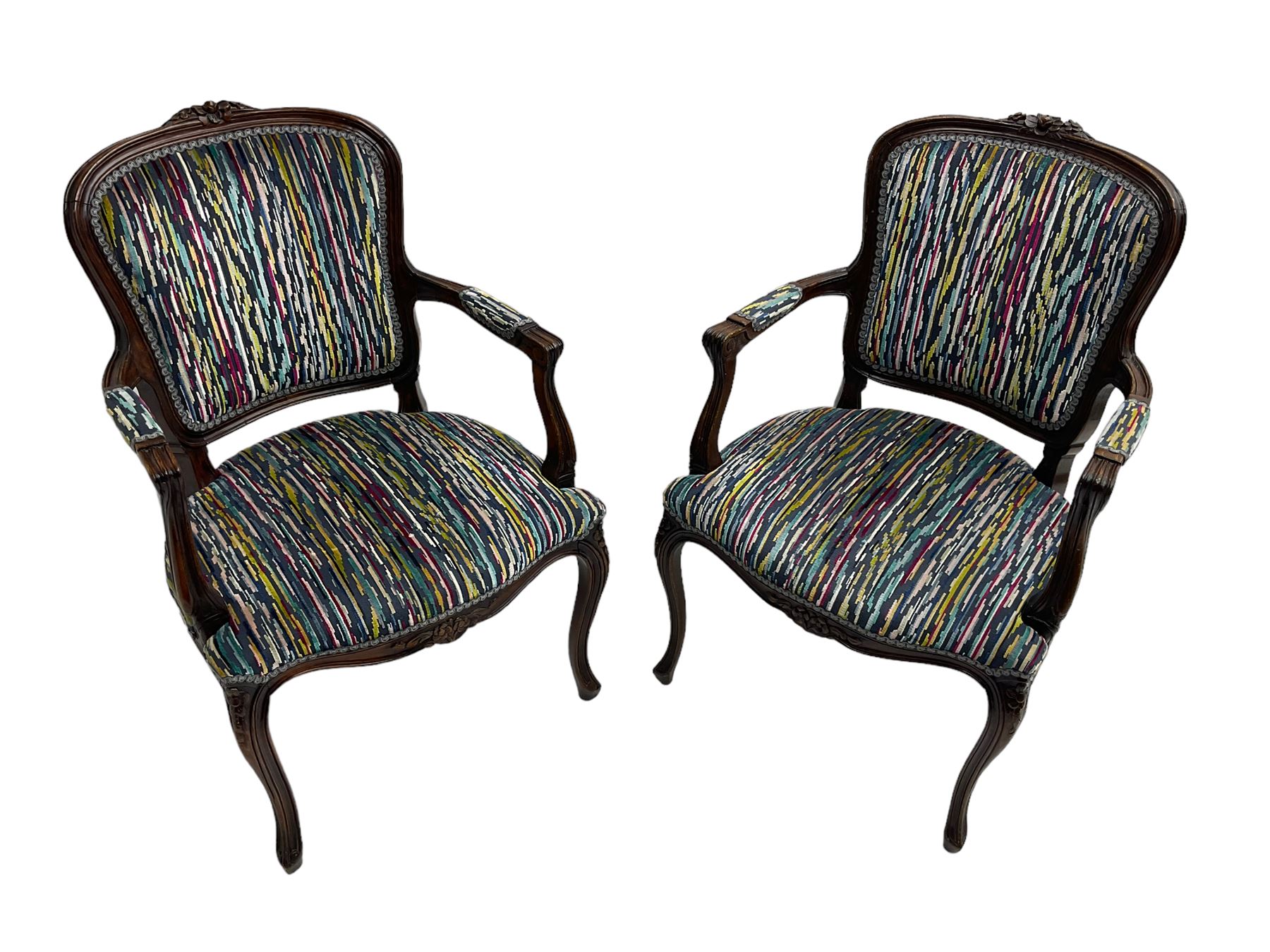 Pair of French design open armchairs, the moulded frame carved with flower heads, upholstered seat, back and arms, on cabriole supports