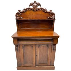 Victorian mahogany chiffonier, raised back with carved C-scroll foliage mounts and shelf, rectangular top with rounded corners over frieze drawer and double panelled cupboard, on skirted base