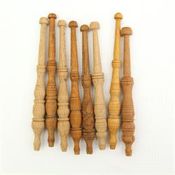 Collection of lace maker's bobbins to include ornate coloured glass examples, eight Maltese wooden bobbins, twenty brass bobbins with turned and textured shafts, together with various wooden examples, some with ornate glass beaded weights/ spangles 