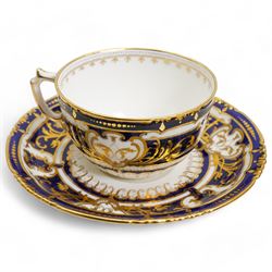 Royal Crown Derby tea service for twelve, circa 1930, comprising twelve teacups, saucers & tea plates, two serving plates, sugar basin and milk jug, each piece decorated with cobalt blue and gilt moulded borders, pattern no. 5732