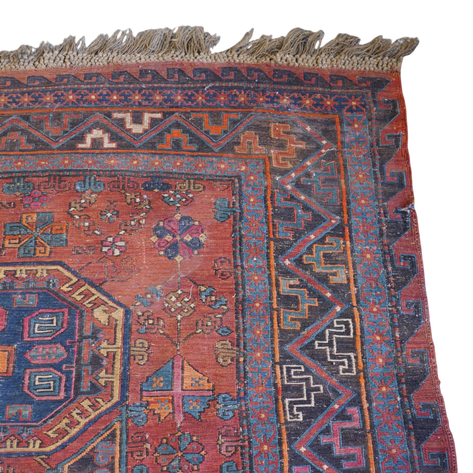 Old Persian red ground flat woven carpet, the field with three large medallions surrounded by small stylised flower head motifs, geometric border enclosed within running water band 346