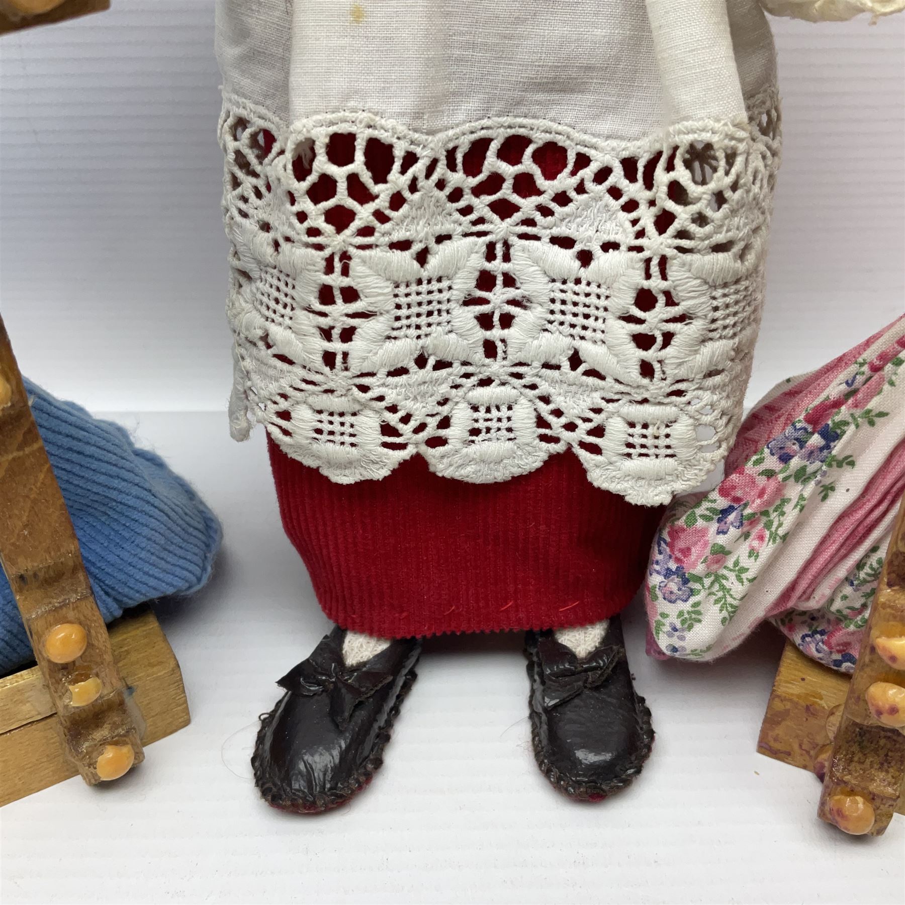 Anna Meszaros Hungary - two hand made needlework figurines, each of a young girl kneeling by an alter rail praying H28cm; together with another similar of a chorister H29cm (3)  Auctioneer's Note: Anna Meszaros came to England from her native Hungary in 1959 to marry an English businessman she met while demonstrating her art at the 1958 Brussels Exhibition. Shortly before she left for England she was awarded the title of Folk Artist Master by the Hungarian Government. Anna was a gifted painter of mainly portraits and sculptress before starting to make her figurines which are completely hand made and unique, each with a character and expression of its own. The hands, feet and face are sculptured by layering the material and pulling the features into place with needle and thread. She died in Hull in 1998.