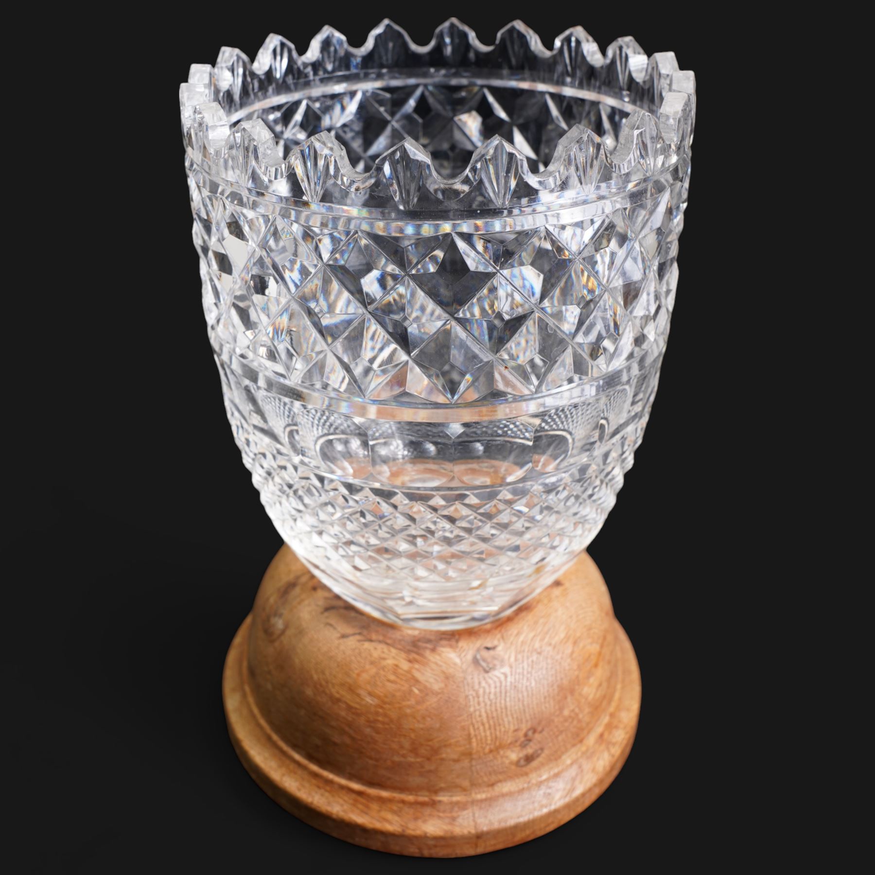 Large Waterford crystal vase, on replacement turned oak stand, H26.5cm, together with a John Rocha for Waterford crystal vase, H25.5cm (2)