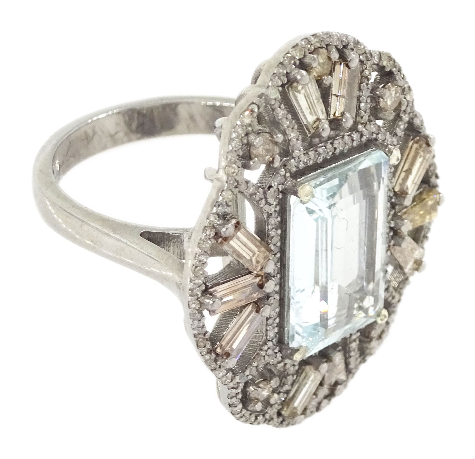 Large silver aquamarine and diamond pierced design ring, the central emerald cut aquamarine of approx 3.75 carat, with baguette and round brilliant cut diamond surround, total diamond weight approx 1.75 carat