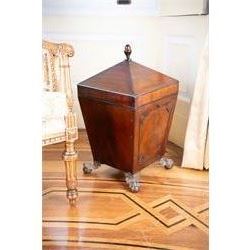 George III mahogany wine cooler or cellarette, the pointed hinged lid with turned final, square tapering body with applied geometric mouldings, on gilt metal and foliate cast ball and claw feet, with metal liner 