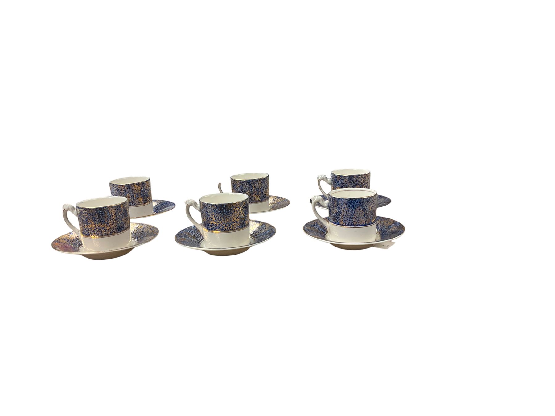 Set of six gilt and cobalt blue coffee cans and saucers