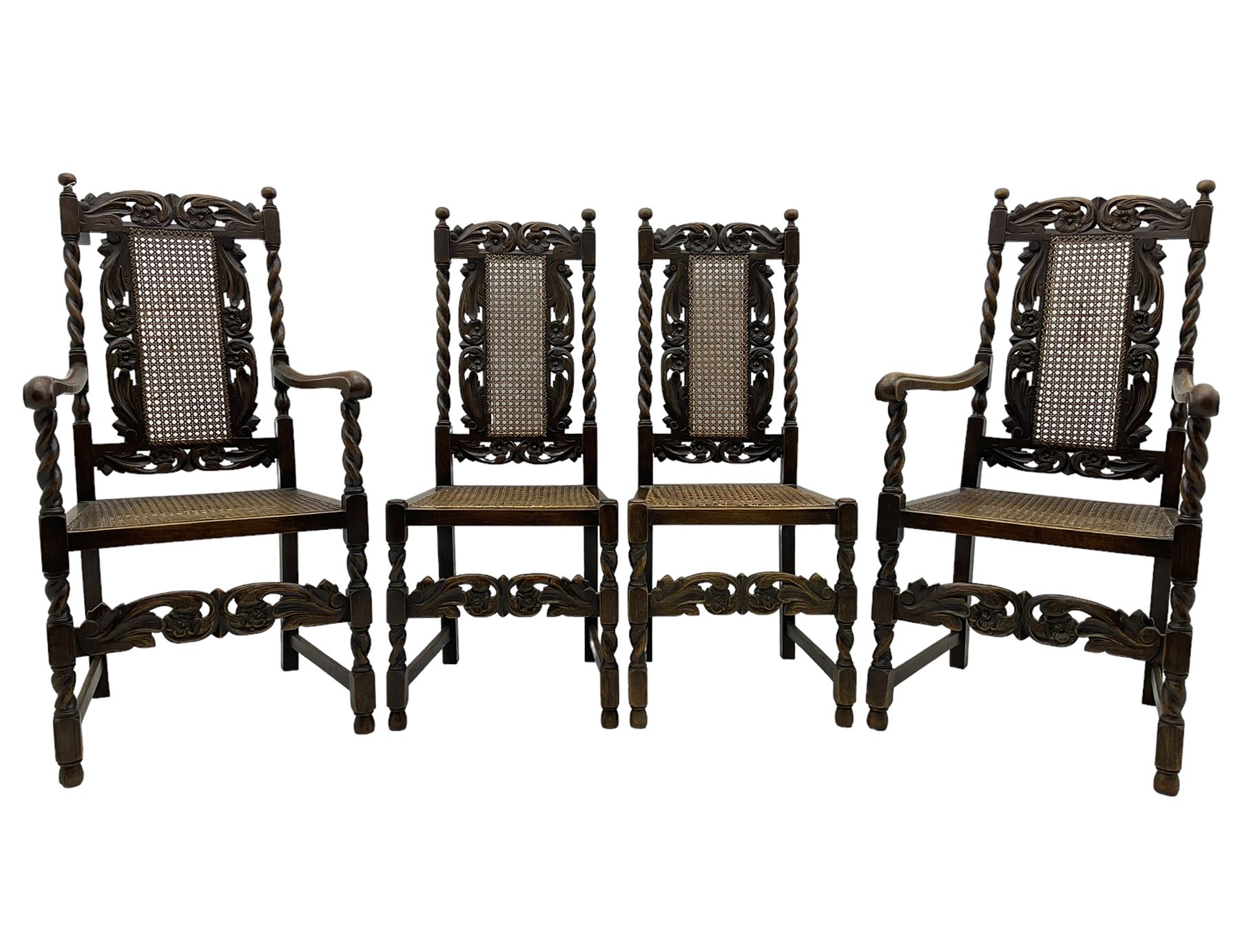 Set of seven (5+2) 19th century Carolean design oak dining chairs, scroll leaf and flower head carved cresting rail over spiral turned uprights and cane work back, the cane work seat on spiral turned supports united by plain stretchers, scrolled leaf carved middle rail 