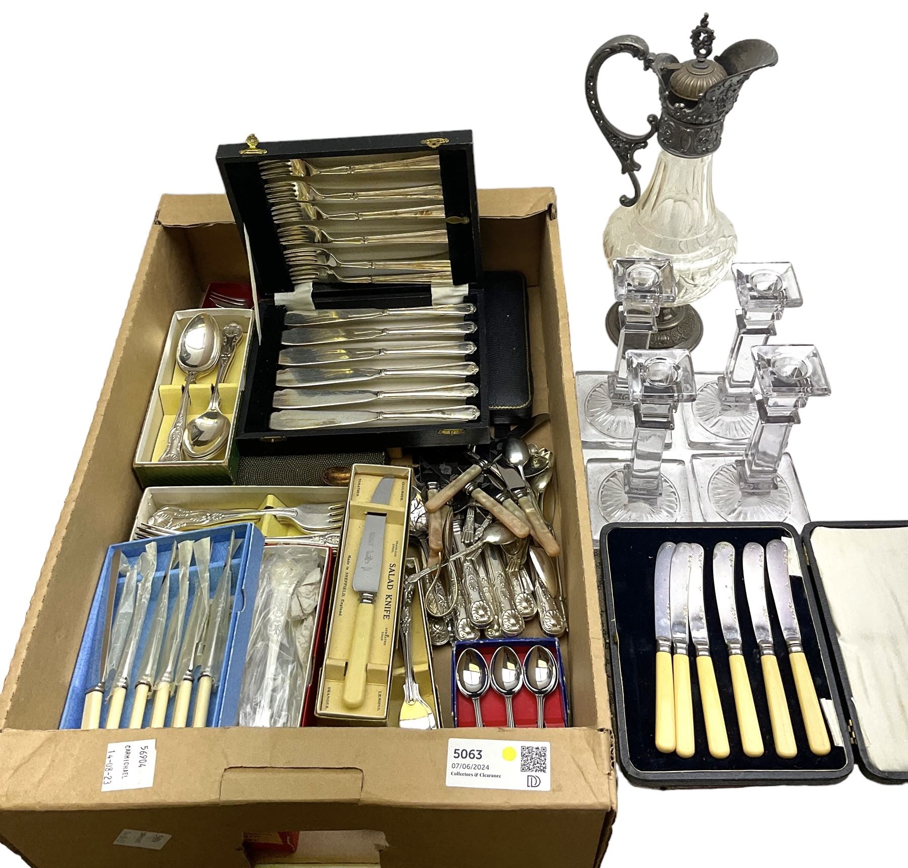 Metal mounted clear glass claret jug, together with a set of four clear glass candlesticks, and a group of assorted silver plated flatware, to include a number of sets, some cased, in one box 