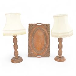 Pair of Kashmir carved hardwood table lamps, with cream fabric tassel shades, and a matchi...