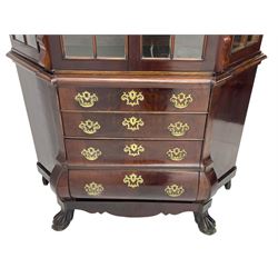 19th century Dutch mahogany vitrine on chest, shaped moulded pediment with central C-scroll and flowerhead carved mount, enclosed by two astragal glazed doors, the interior fitted with fabric lined shelves, four graduating long drawers below, on ball and claw carved feet 