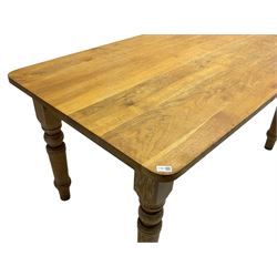 Limed oak dining table, rectangular top with rounded corners, on turned supports