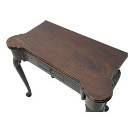 Late 18th century Irish mahogany tea table, rectangular form with projecting stepped rounded corners, fold-over action top over single frieze drawer within cock-beaded surround, on shell and bellflower carved cabriole supports, single gate-leg action base 