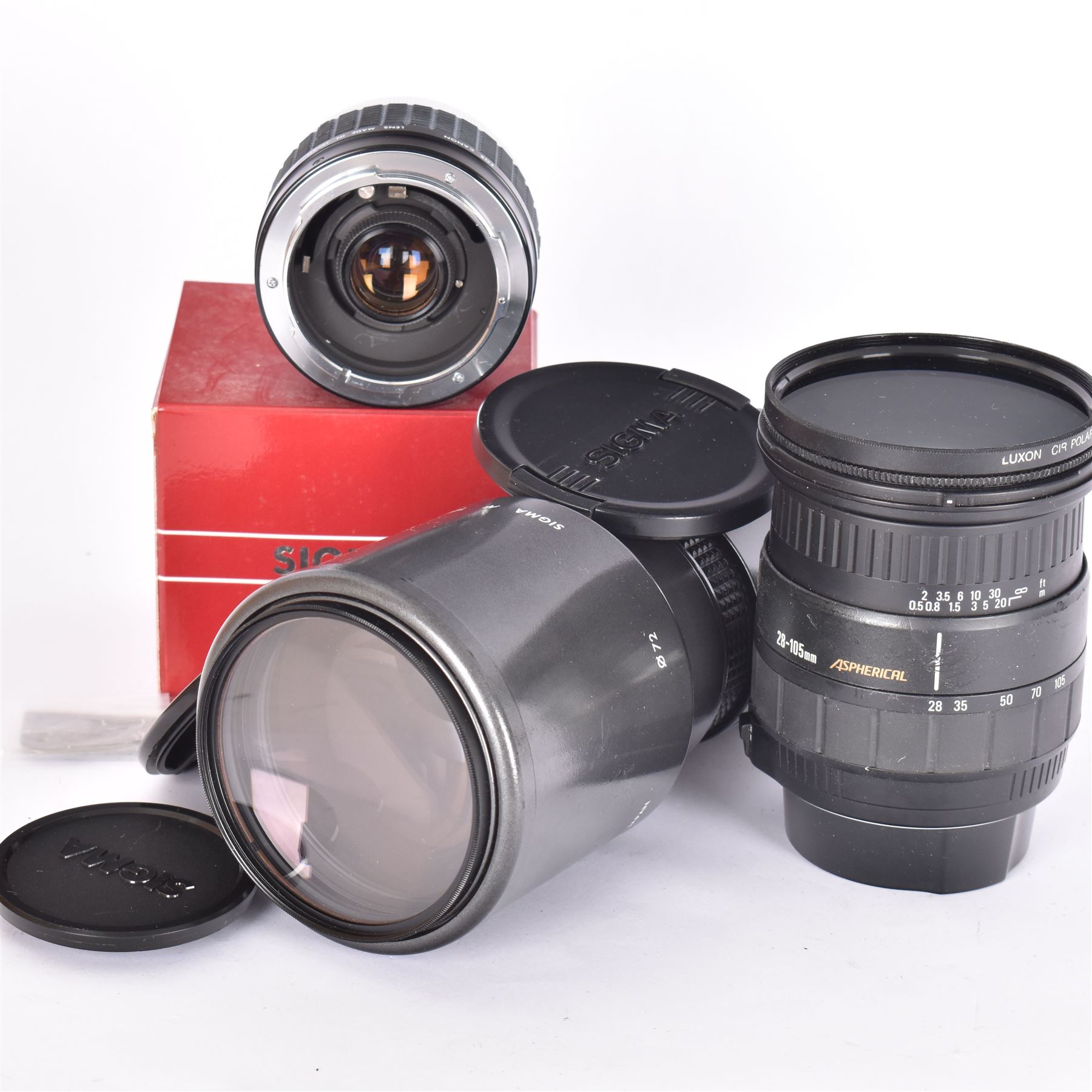 Two Sigma camera lenses, comprising 28-105mm 1:2.8-4 aspherical zoom lens serial no. 1005268, with Luxon CIR polarizer 72mm filter, hood and lens caps, an AF Tele 1:56 f=400mm multi-coated lens, serial no. 3021847, and a Sigma Tele-Macro multi-coated 2x teleconverter, boxed