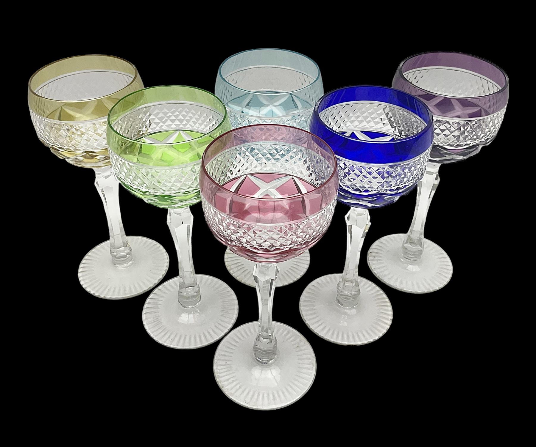 Set of six Harlequin coloured glass hock glasses, each with a band of hobnail decoration, upon faceted stems, H19.5cm