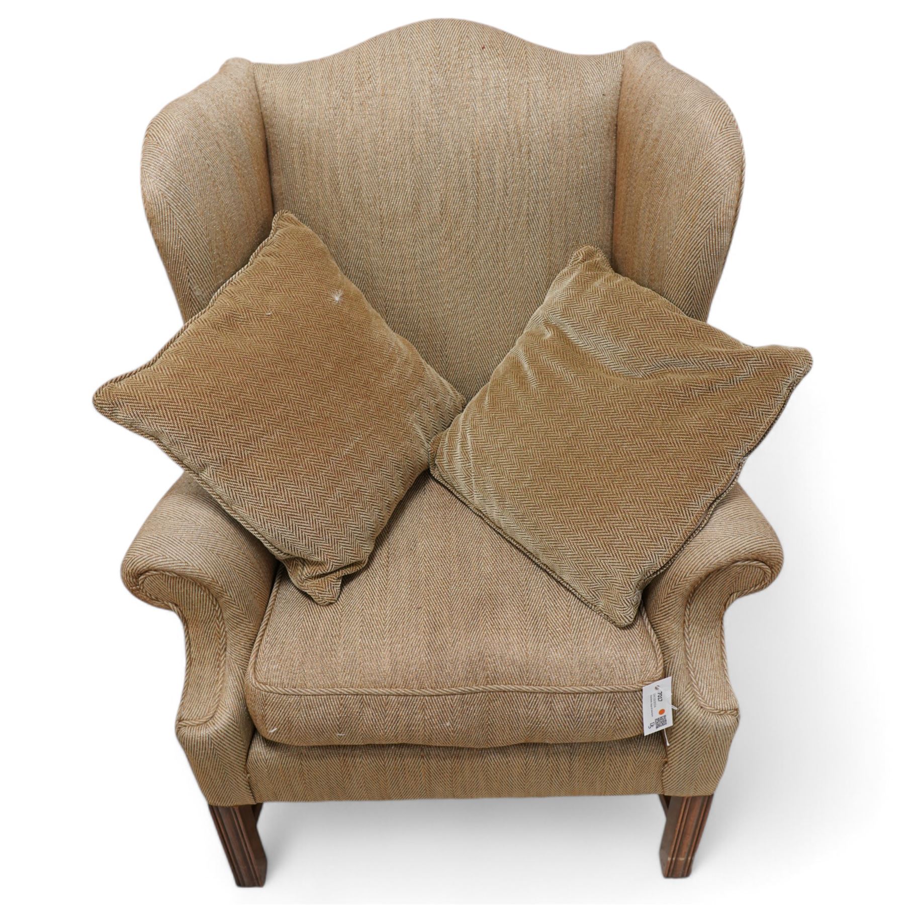 Georgian design wingback armchair, upholstered in brown herringbone fabric, on square moulded supports united by plain H-stretchers