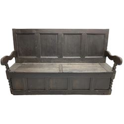 18th century oak box seat settle bench, pegged construction with quadruple panelled back over double hinged box seat, shaped projecting arms with scroll carved terminal detail, on block and bobbin turned front supports, panelled front within moulded frame