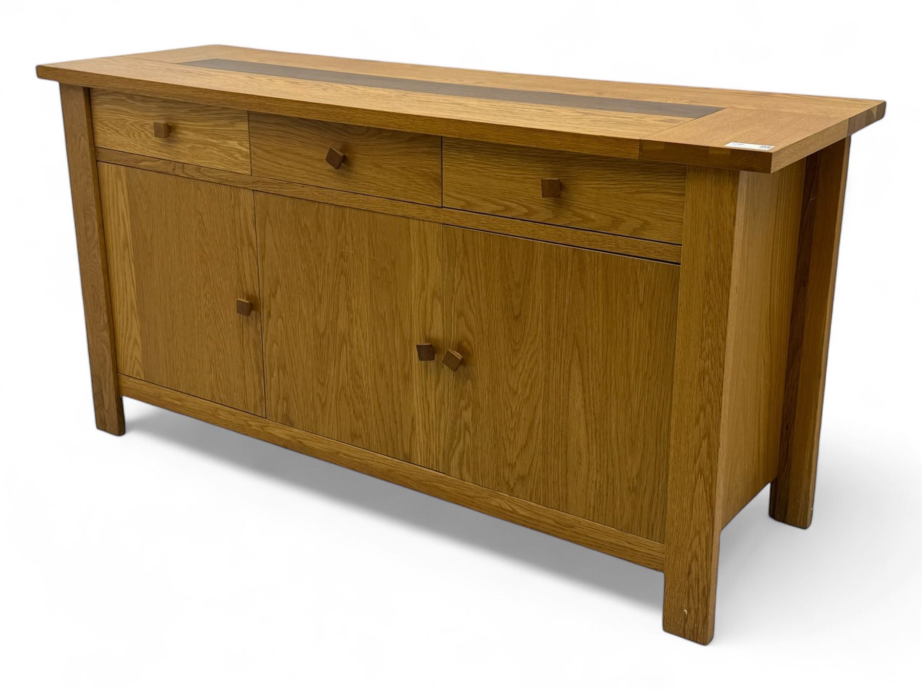 Contemporary oak sideboard, rectangular top with central contrasting plank, over three frieze drawers and three cupboards with enclosed shelving, on rectangular stile supports