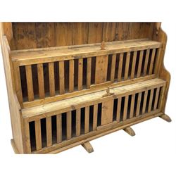 Waxed pine 'chicken coop' or 'hutch' dresser, projecting cornice over shaped frieze and three tier plate rack, the stepped waterfall lower section fitted with two slatted chicken coops, on sledge feet 